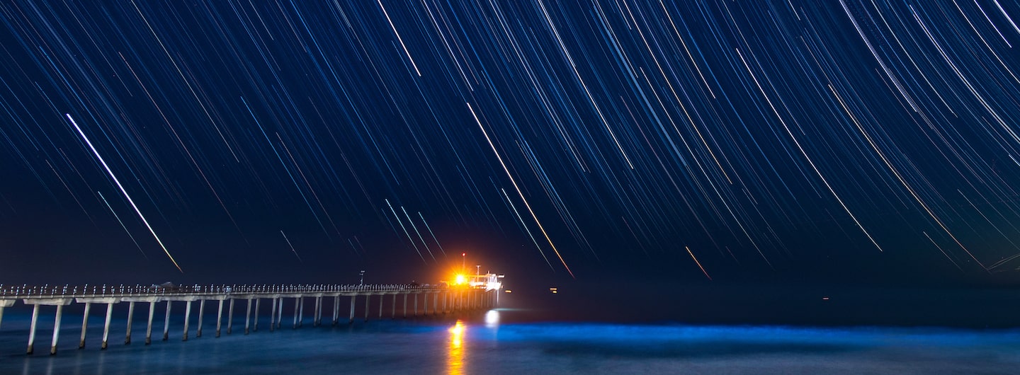 time-lapse photo of red tide at night